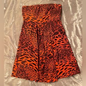 100% silk pink and black leopard print strapless mini dress. Like new!